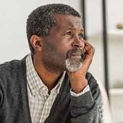 Sad older man looking off into space